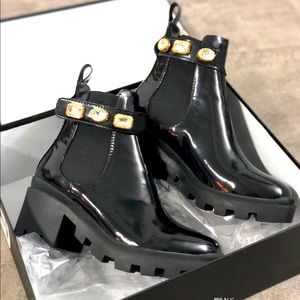 Black boots with gold accents